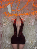 Metallic sleeveless mini dress with halter neckline and ruched knot front, dark red