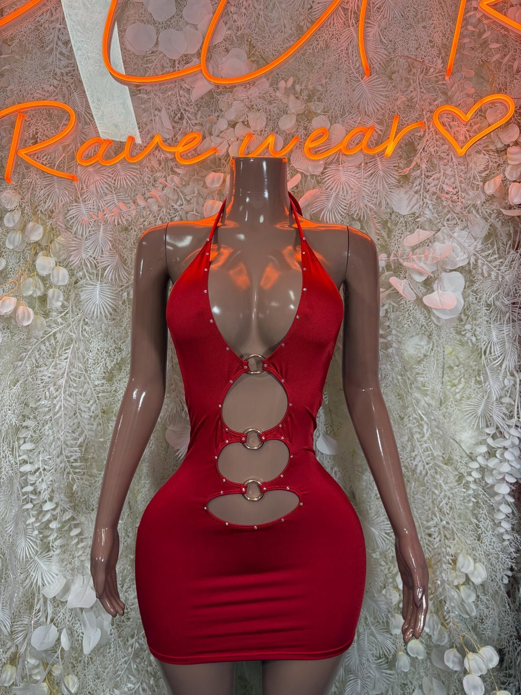 Red halter mini dress with circular ring cutouts down the chest and waist