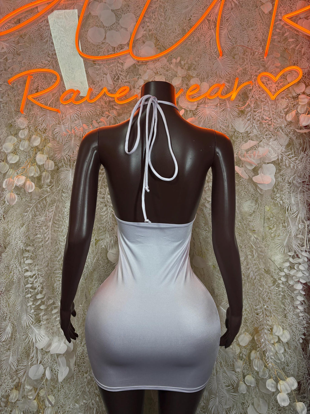 White mini club dress back view, halter straps tied at neck and open back