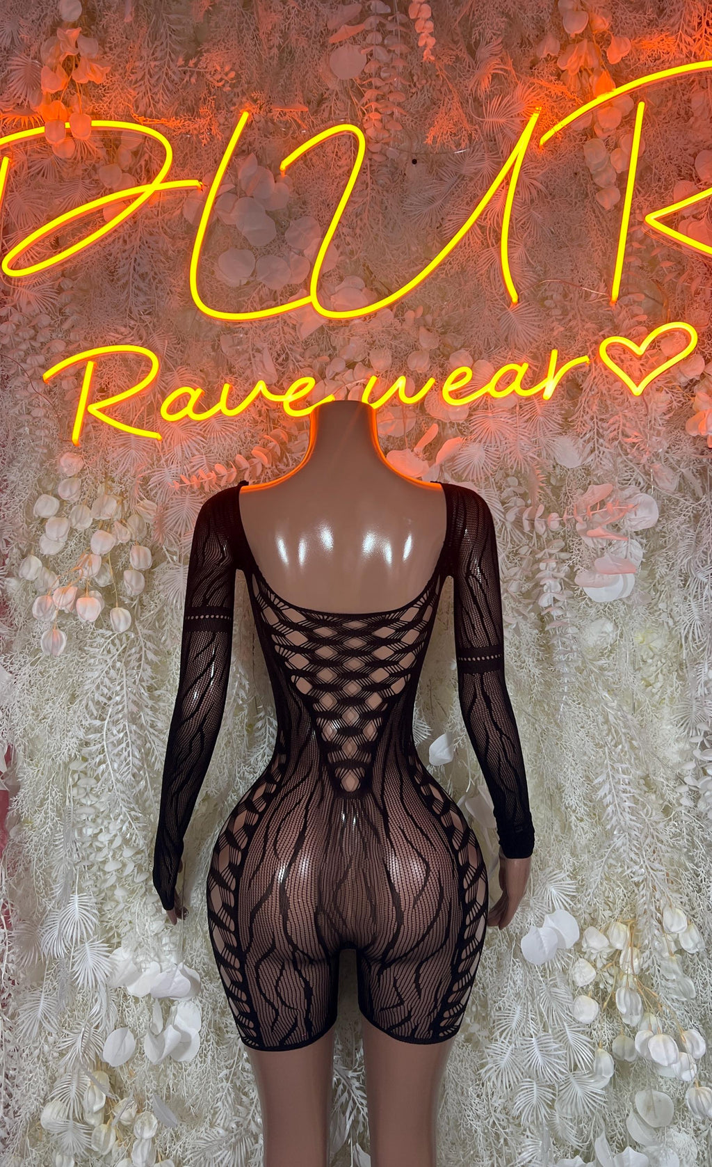 Black mesh bodysuit with long sleeves and crisscross back cutout