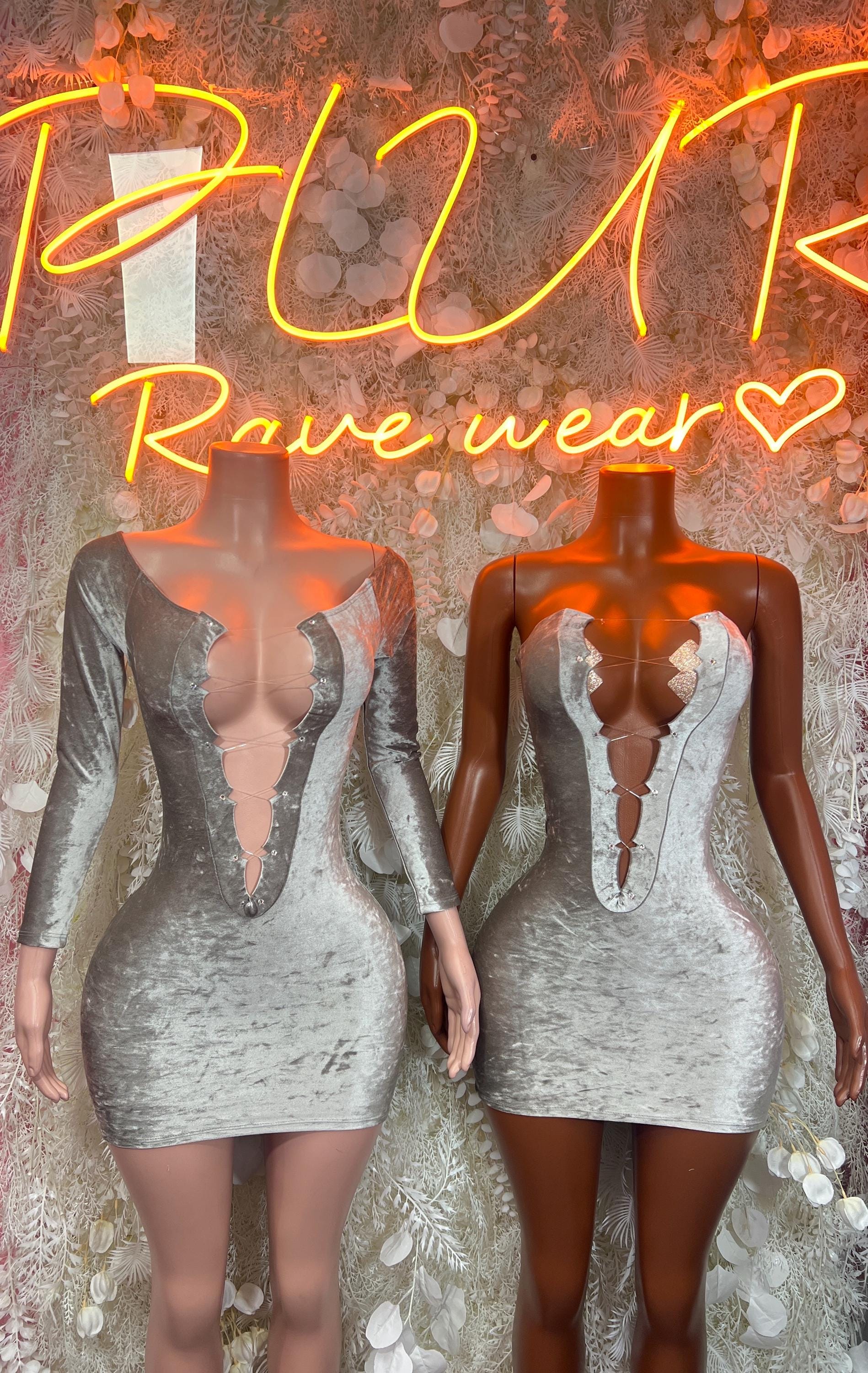 Pair of silver velvet mini dresses with deep V neckline and long sleeves, front views