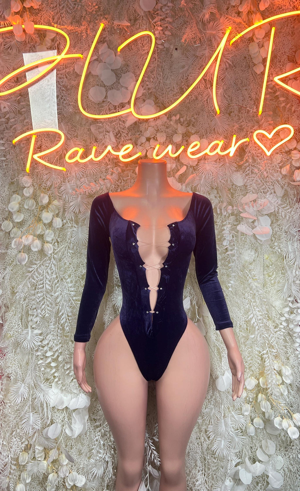 Dark blue velvet bodysuit with long sleeves and deep V neckline, snap front