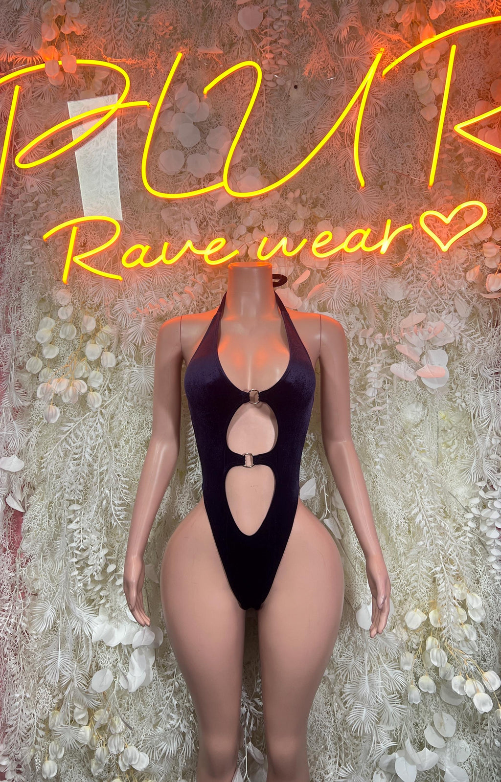 Purple velvet halter bodysuit with long sleeves and oval cutout front