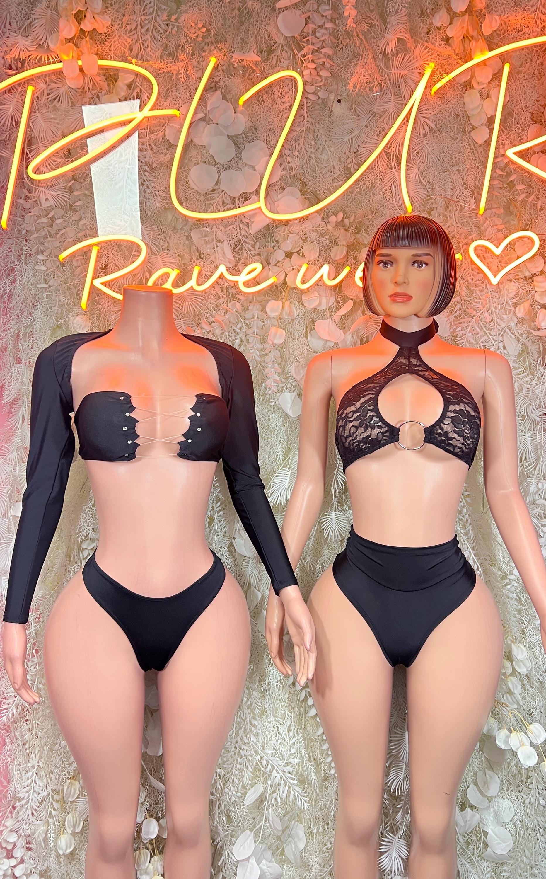 Black two-piece dancewear sets with lace halter tops and high-cut bottoms, side-by-side.