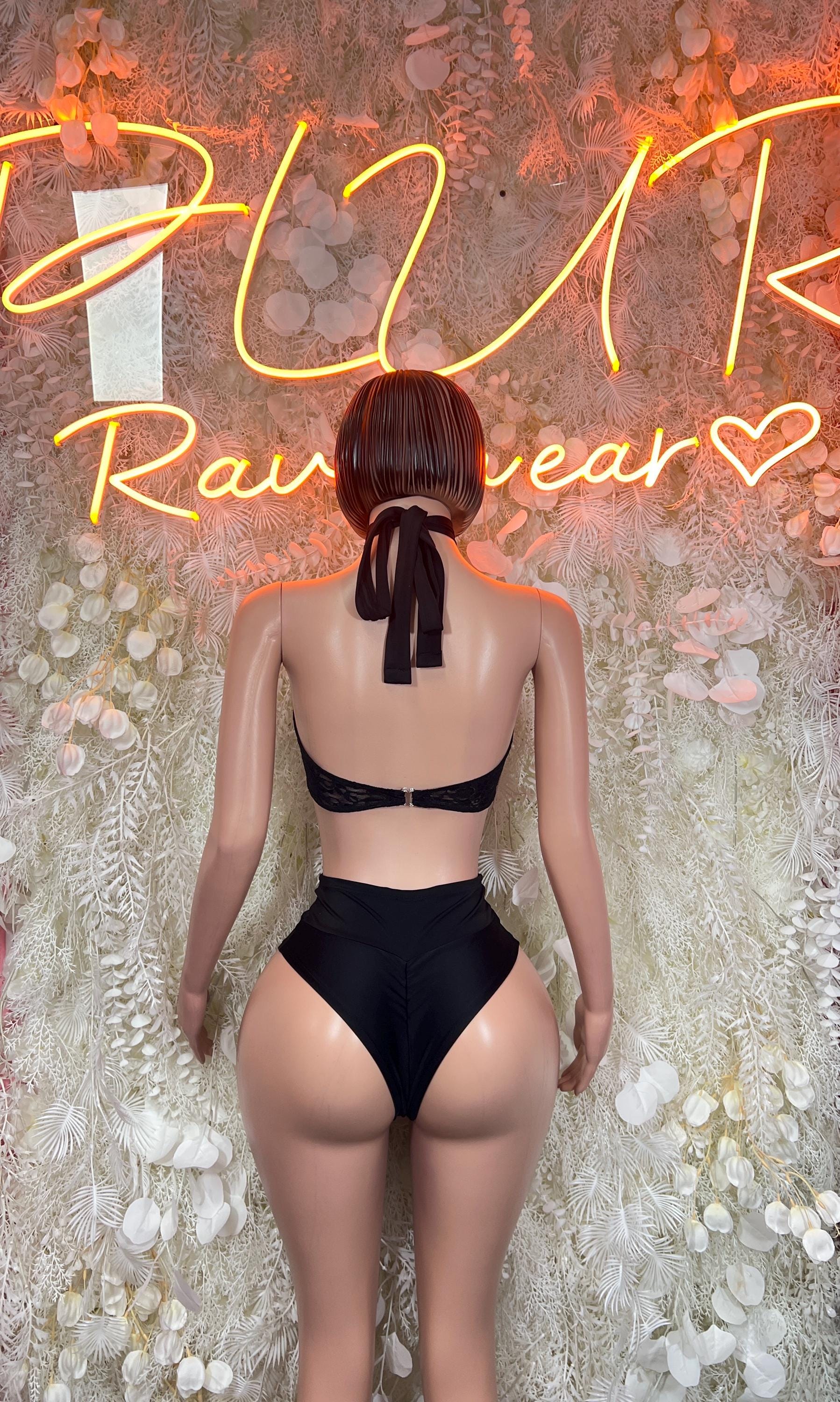 Black lace halter crop top and high-cut thong bodysuit, back view.