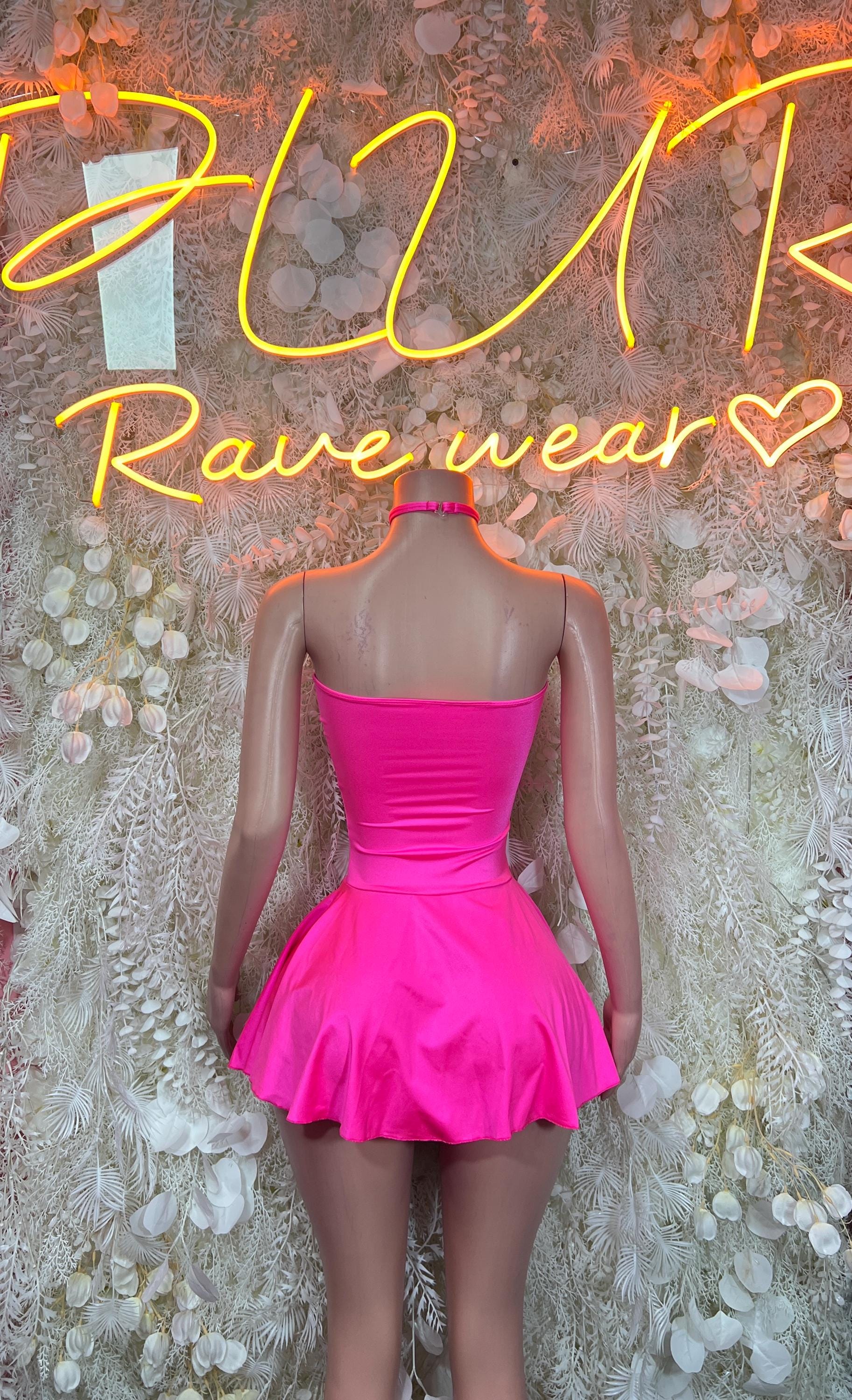 Bright pink strapless mini dress shown from the back, with ruched bodice and flare
