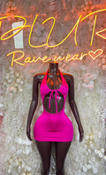 Pink halter mini dress with bow tie at neckline, open back