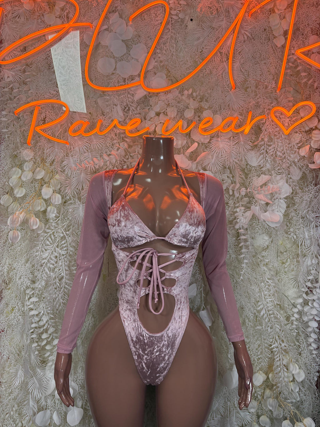 Rose pink velvet bodysuit with metallic silver bra-style cups and lace-up front