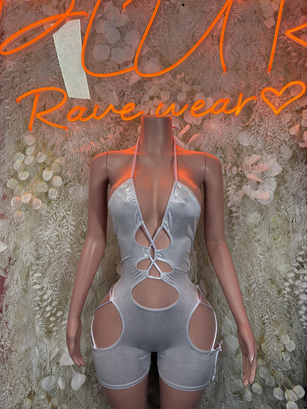 Silver metallic hologram bodysuit with lace-up neckline and side cutouts, front view