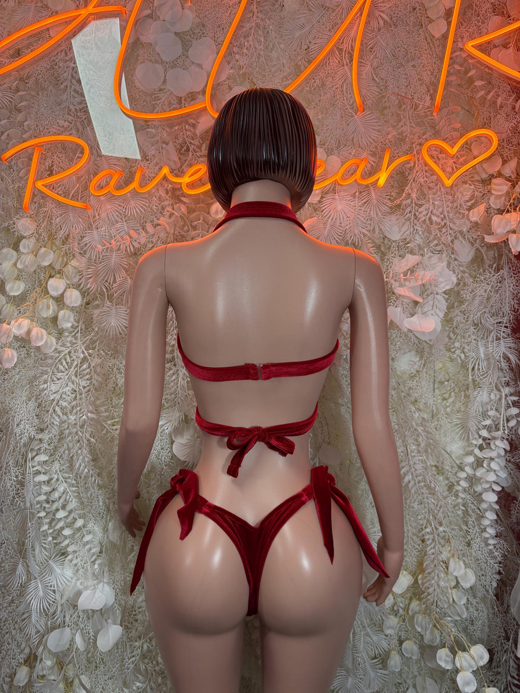 Back view of red velvet halter bra and strappy bikini bottoms set