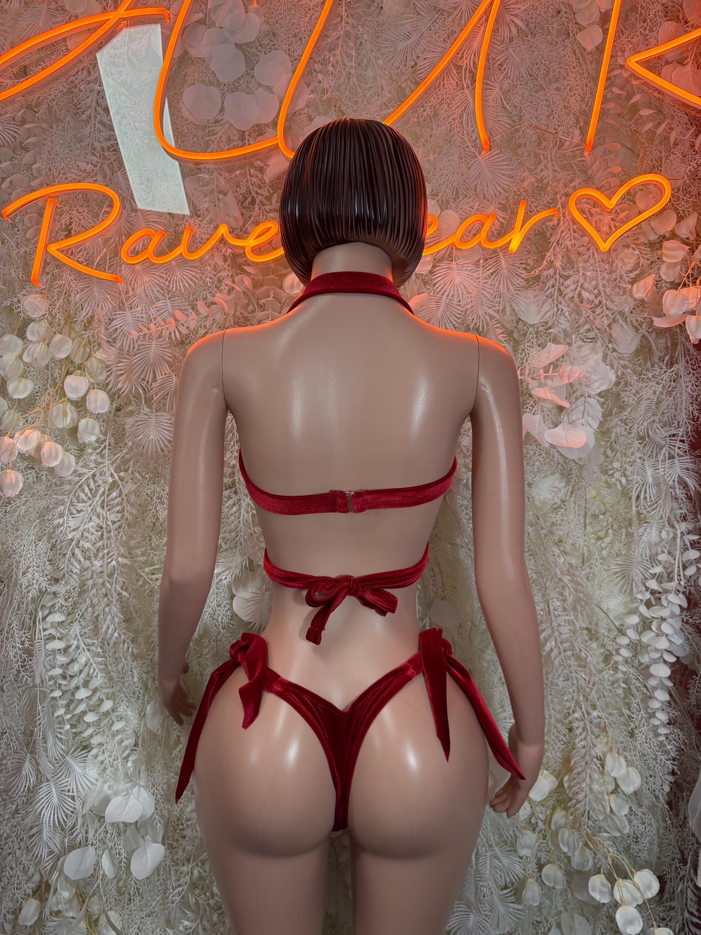 Back view of red velvet halter bra and strappy bikini bottoms set