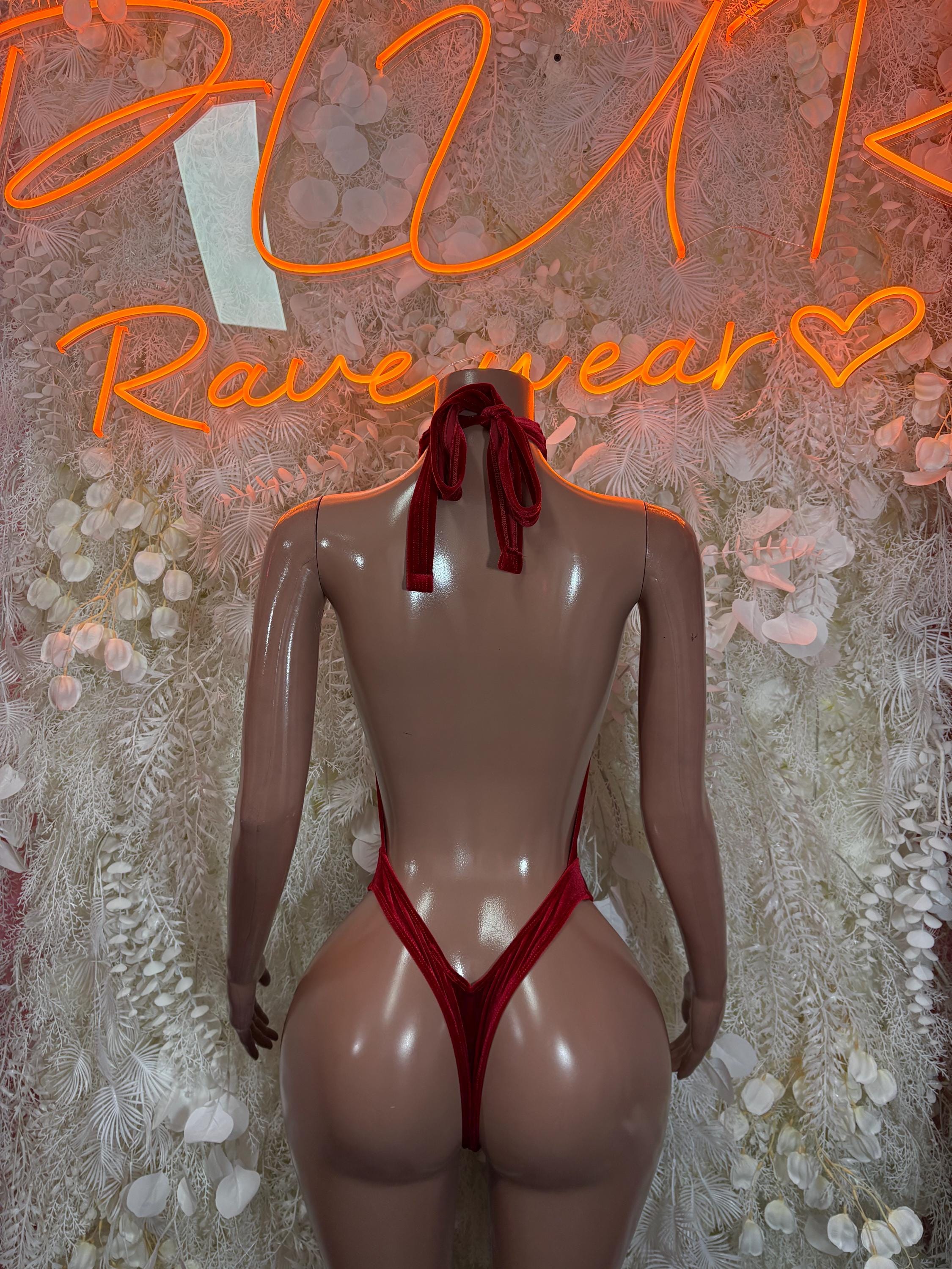 Red velvet rave bodysuit, back view with halter bow at neck and strappy back