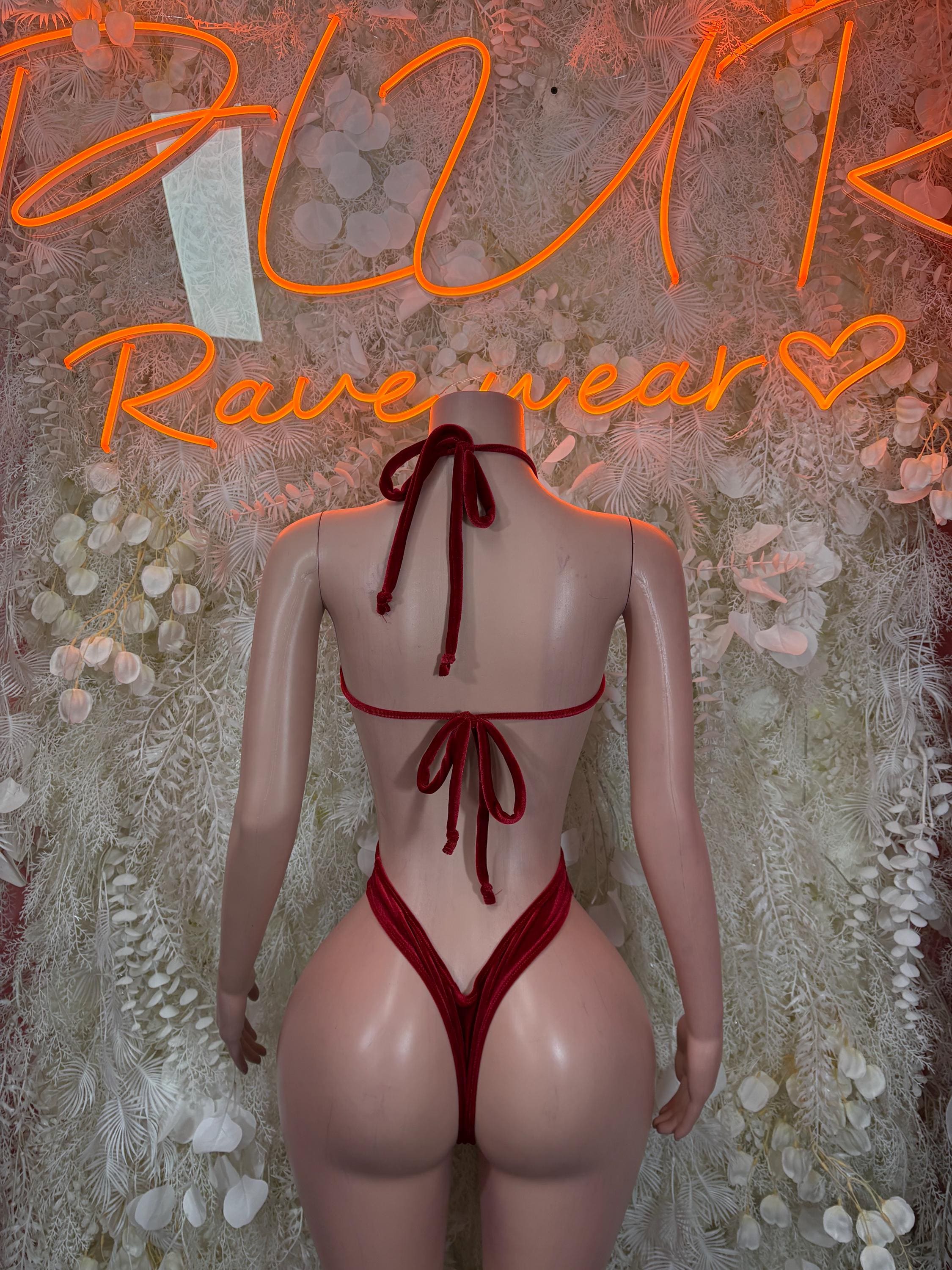 Red velvet bodysuit with halter tie-back, back keyhole and high-cut legs