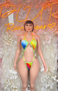 Multicolor one-piece bodysuit with neon green trim and rainbow triangle cutouts