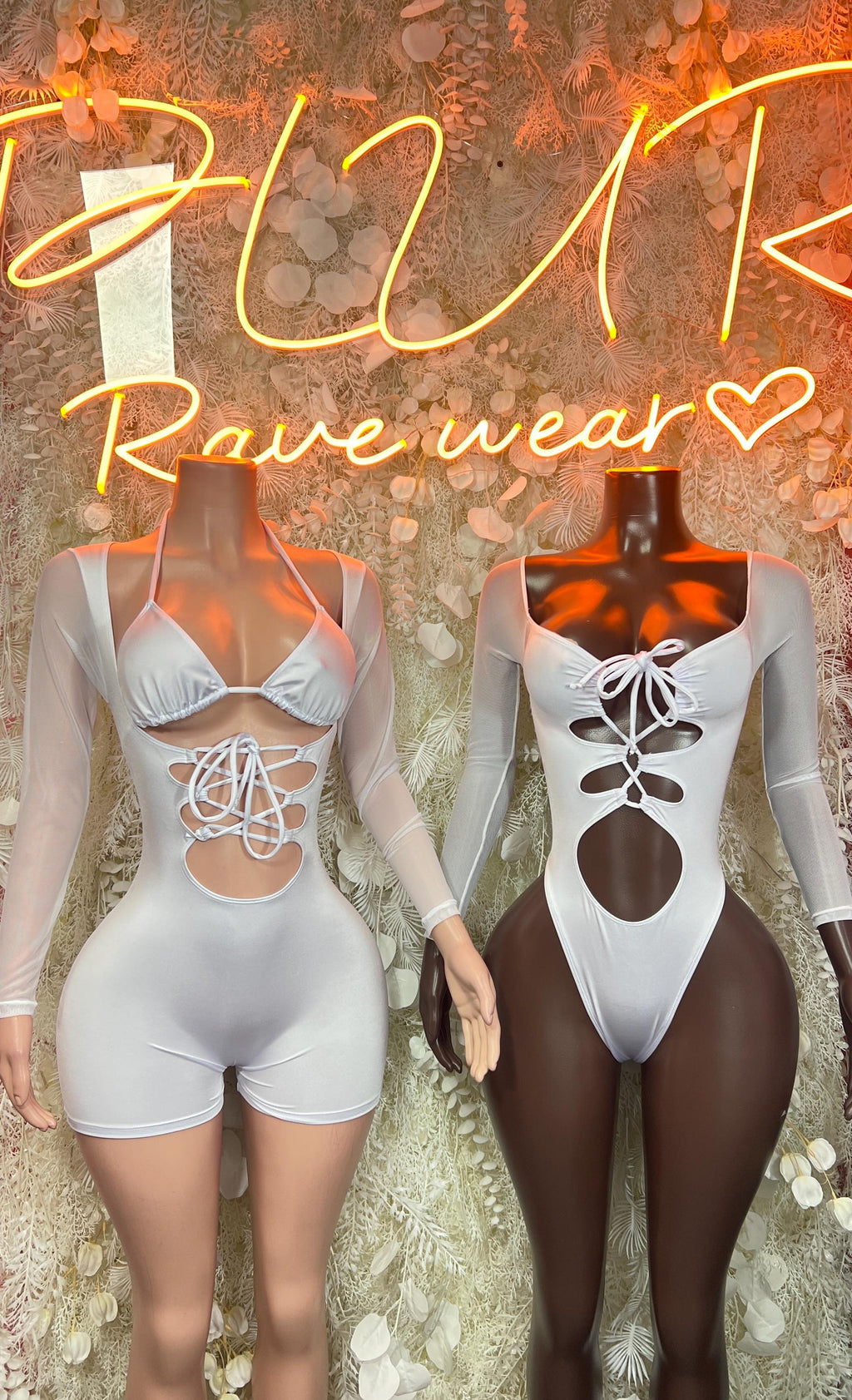 White lace-up bodysuit and matching romper shorts on mannequins