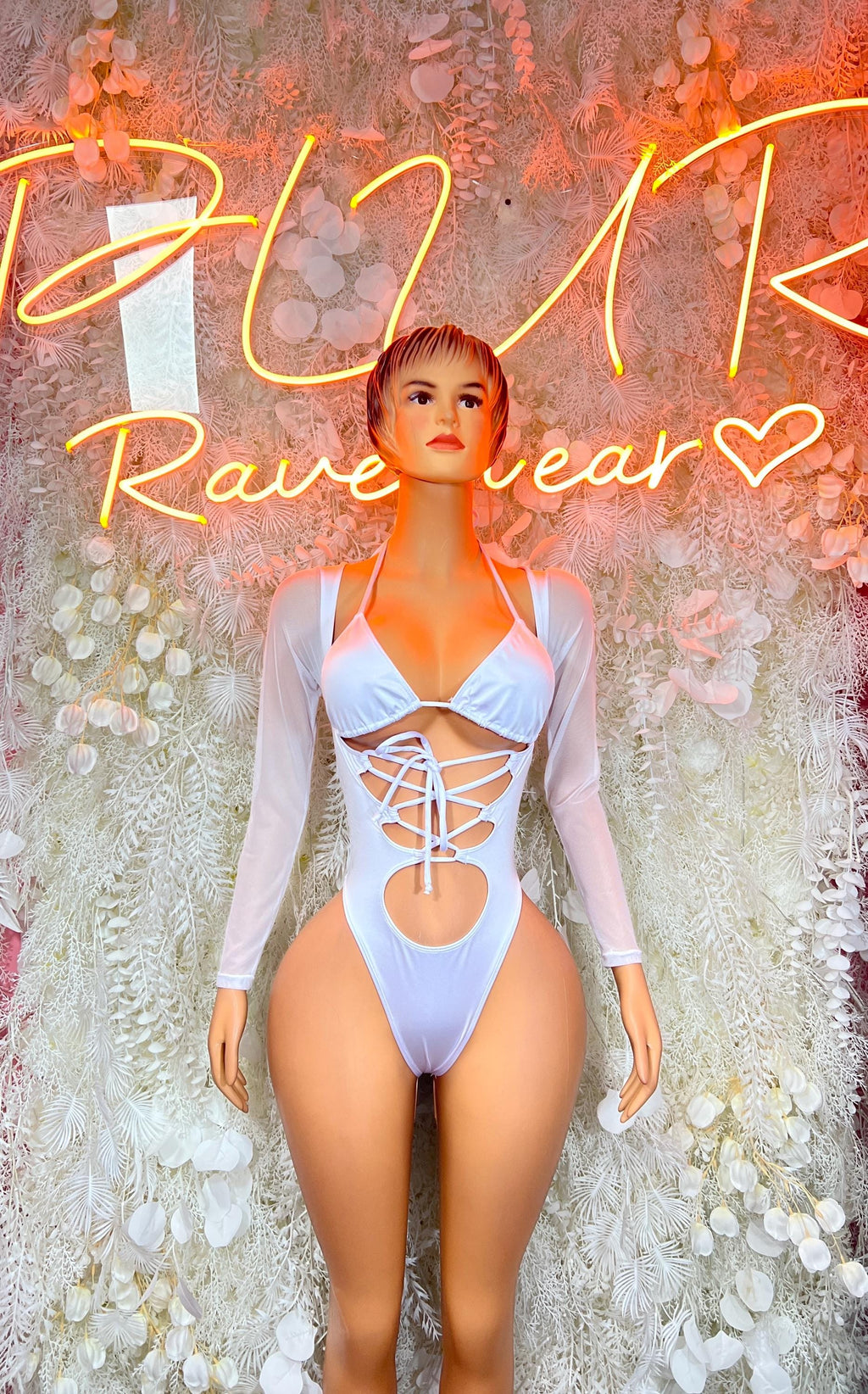 White bodysuit with long sleeves and crisscross lace-up front cutout