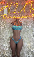 Two-piece glitter bikini set with aqua blue bandeau top and matching thong bottoms