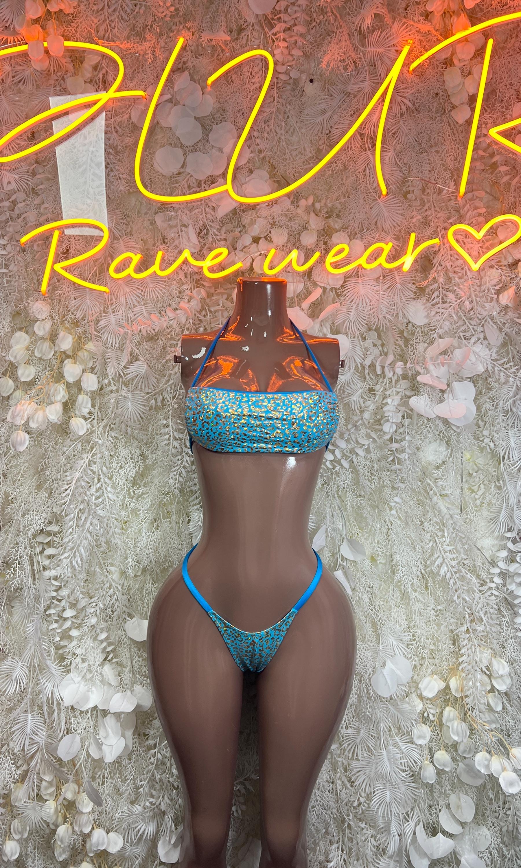 Two-piece glitter bikini set with aqua blue bandeau top and matching thong bottoms