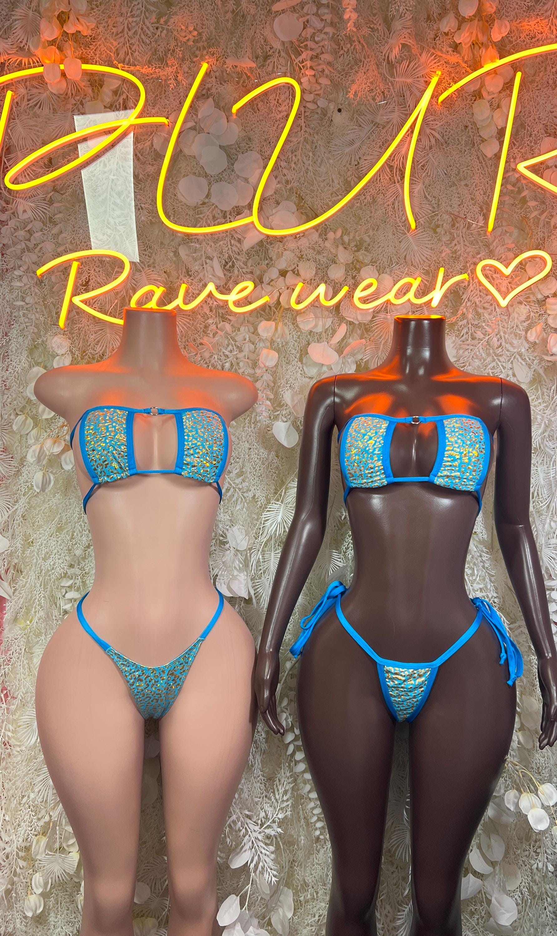 Two aqua patterned two-piece bikinis with matching tops and string bottoms on mannequins