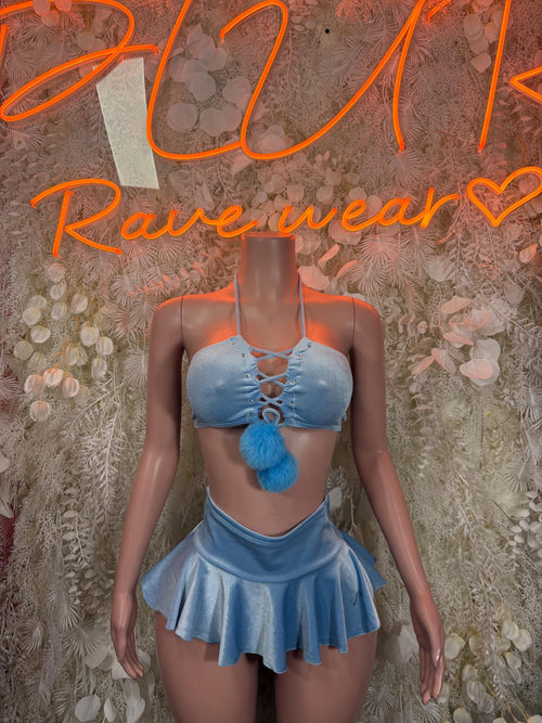 Light blue two-piece rave outfit: lace-up bralette with pom-pom, mini skirt