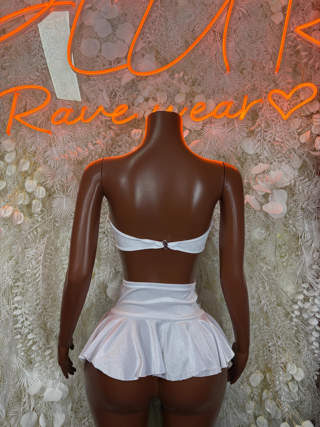 White bandeau top and ruffled mini skirt set, back view