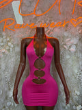 Pink halter mini dress with metal ring cutouts and low back