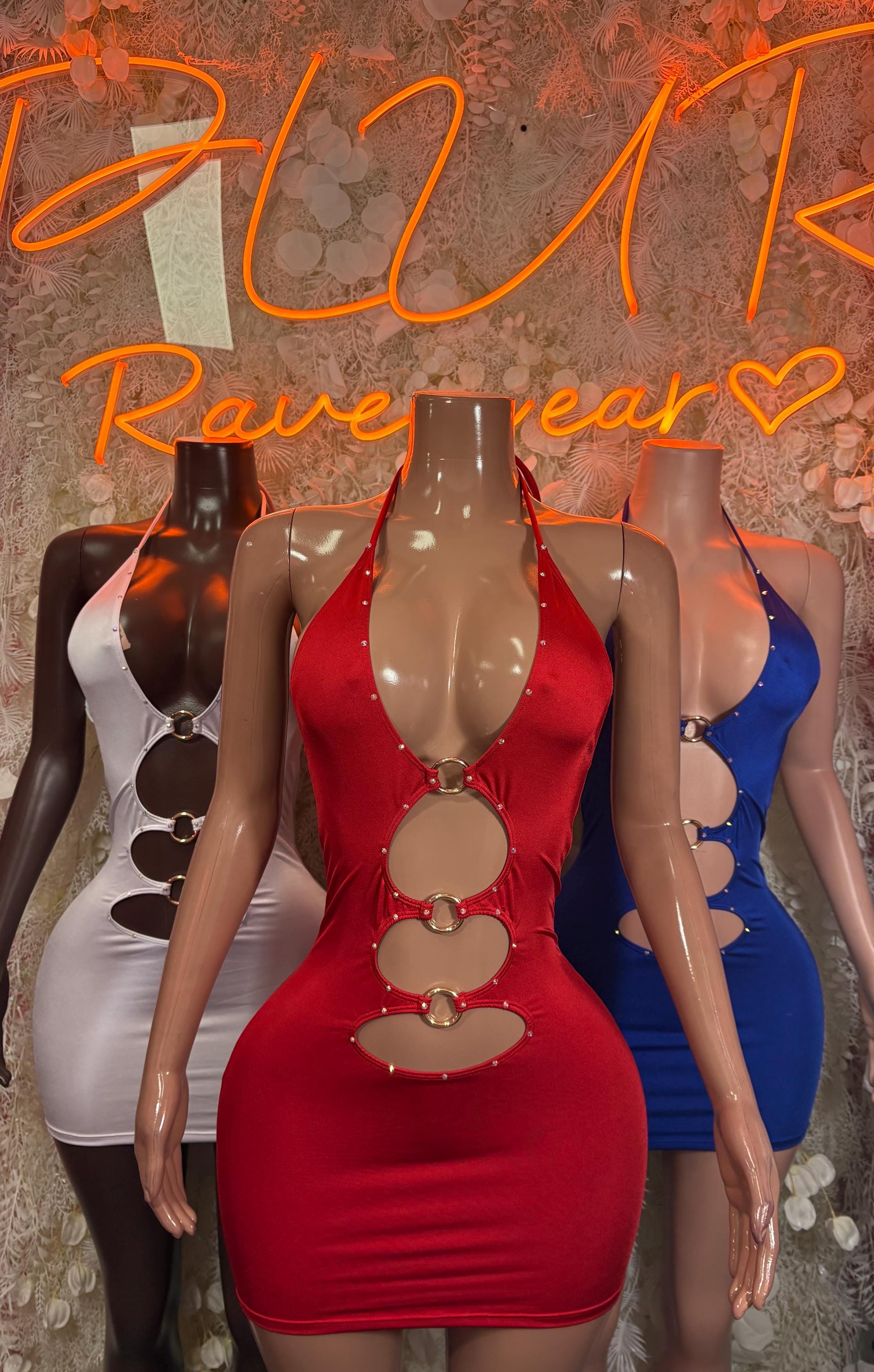 Red halter mini dress with large circular ring cutouts along center front