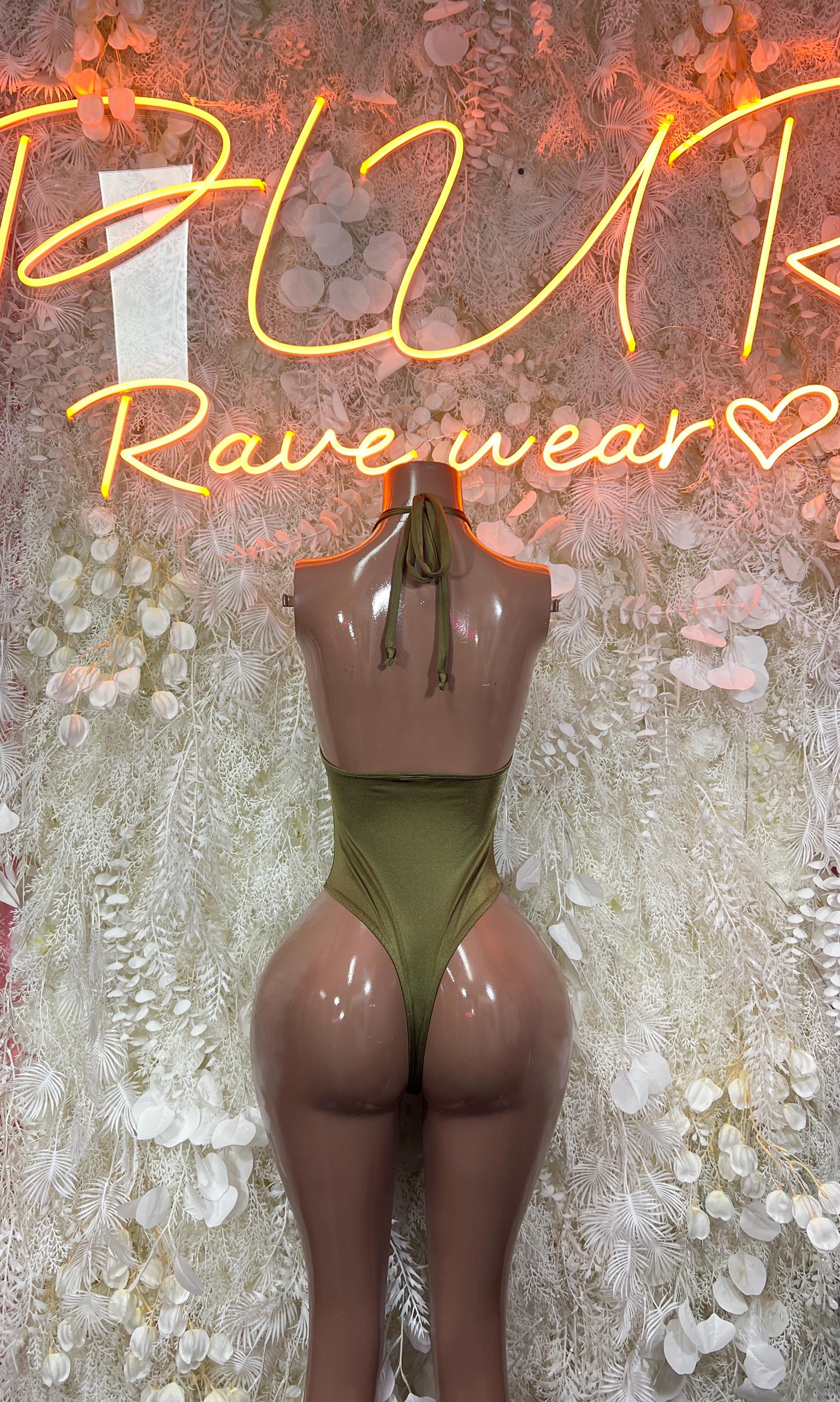 Forest green one-piece dancewear with open back and strappy cutout details