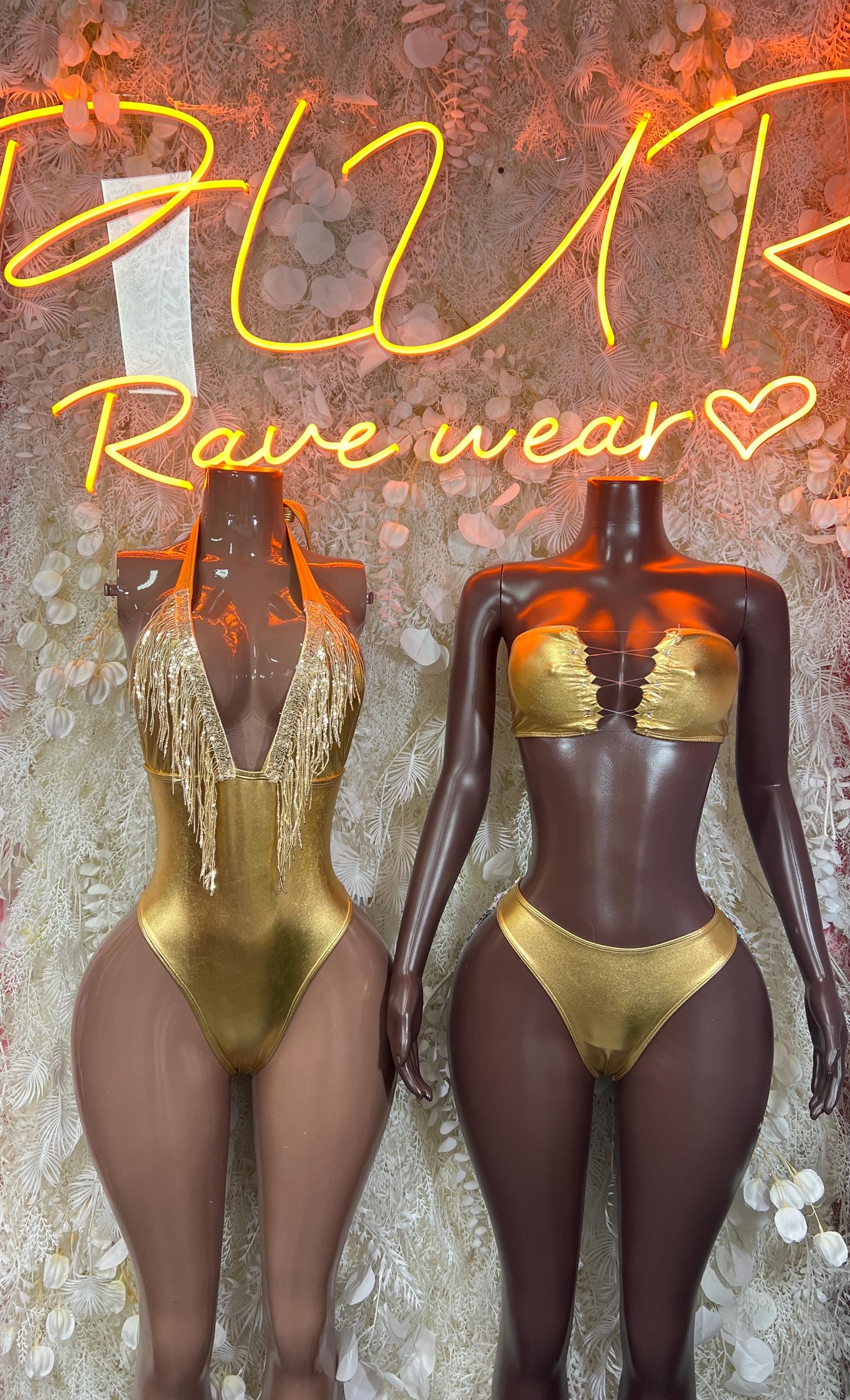 Gold metallic dancewear set with gold bra top and high-cut briefs; gold fringed bodysuit shown.
