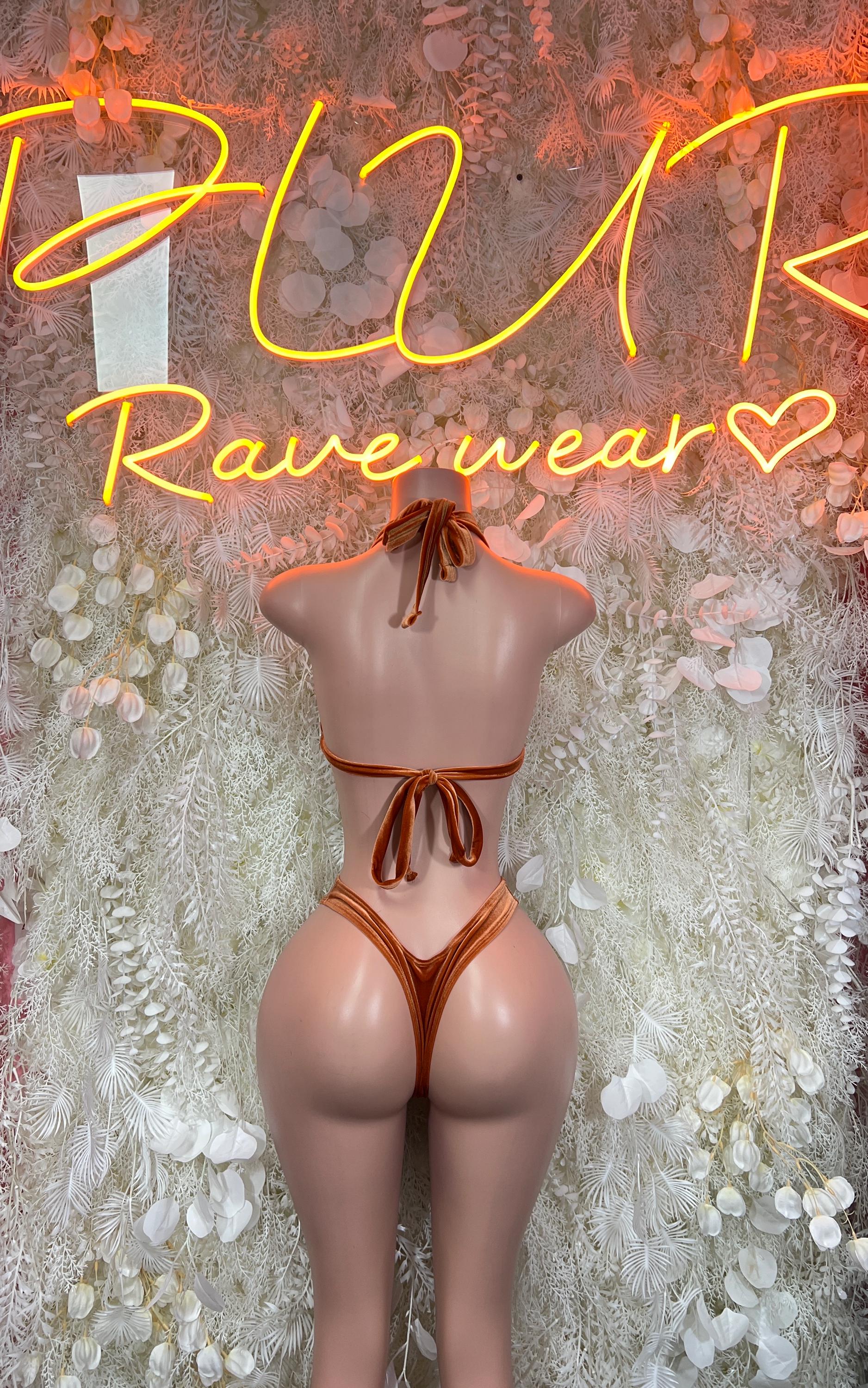 Metallic orange two-piece rave outfit with backless halter top and tied thong bottoms