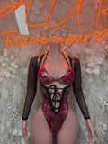 Metallic magenta one-piece bodysuit with black lace-up front and sheer long sleeves