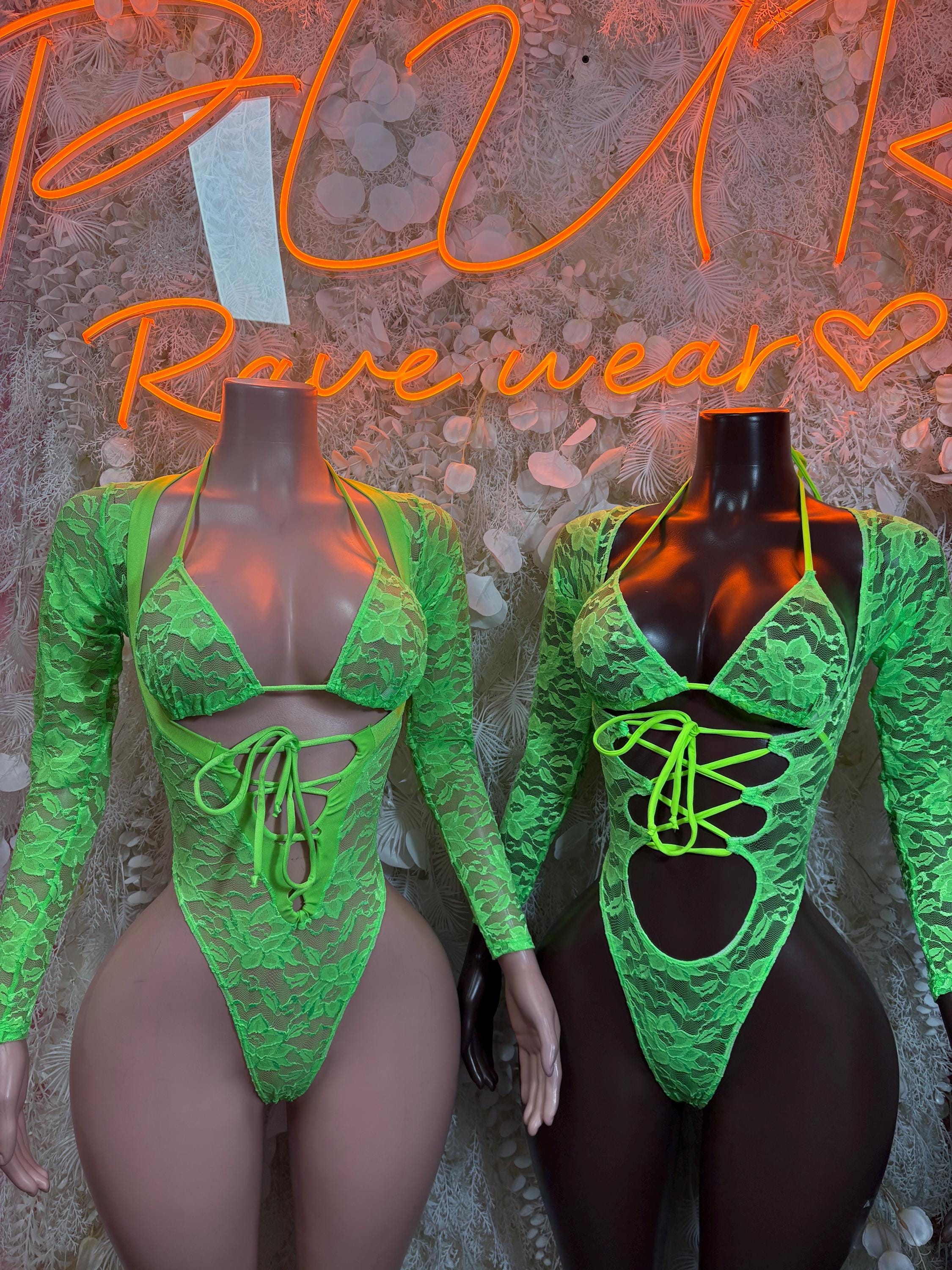 Neon green lace bodysuit with lace-up front neckline and long sleeves, high cut