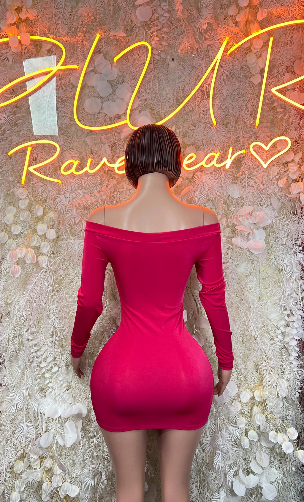 Back view of pink off-shoulder bodycon mini dress with long sleeves