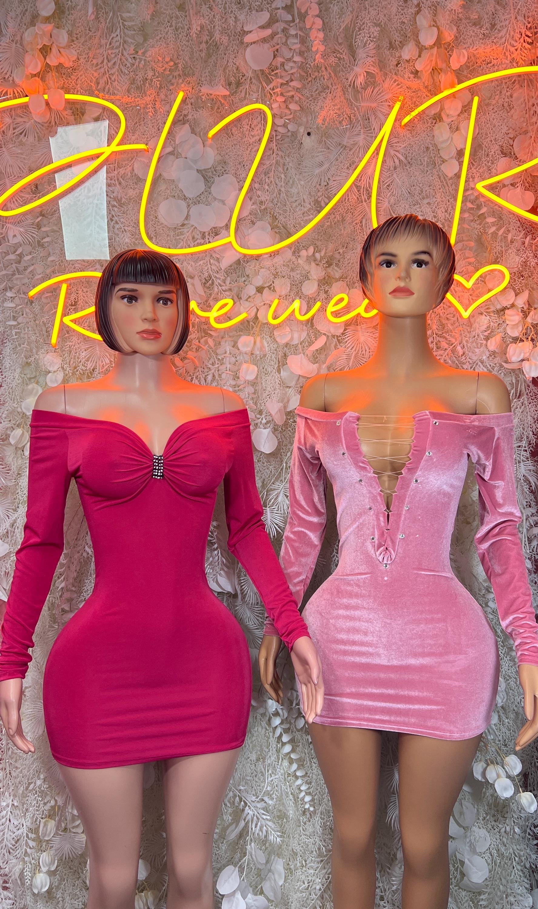 Two pink velvet off-shoulder mini dresses with long sleeves and ruched bodycon fit.