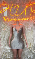 Silver velvet mini dress with deep V neckline, sleeveless, fitted.