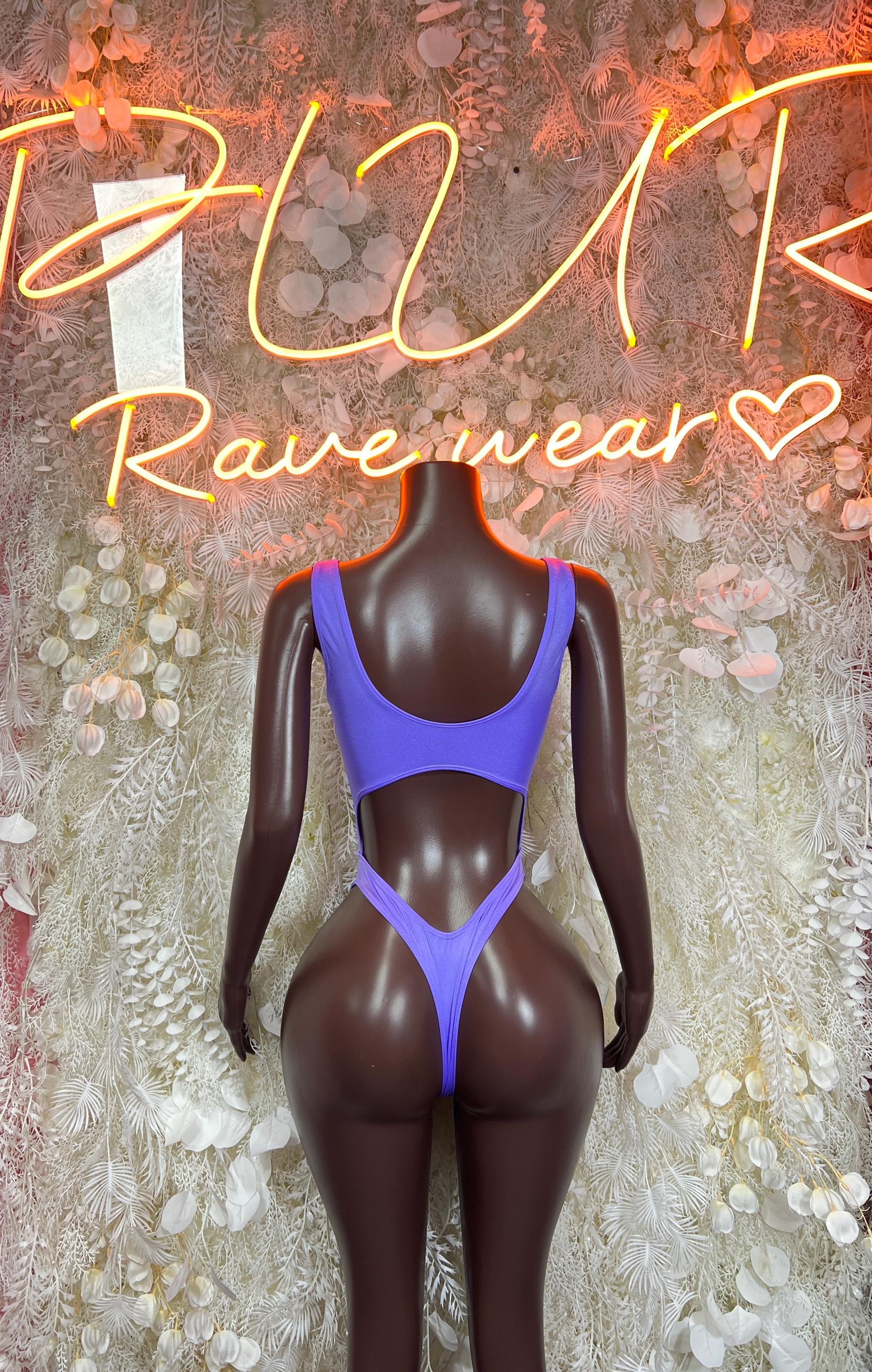 Purple long-sleeve bodysuit with scoop neck and high-cut bottom, front view