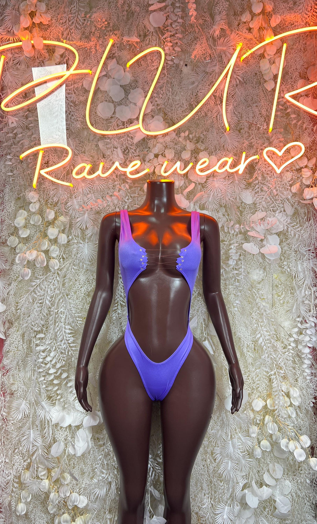 Purple long-sleeve bodysuit with scoop neck and high-cut thong bottom, front view