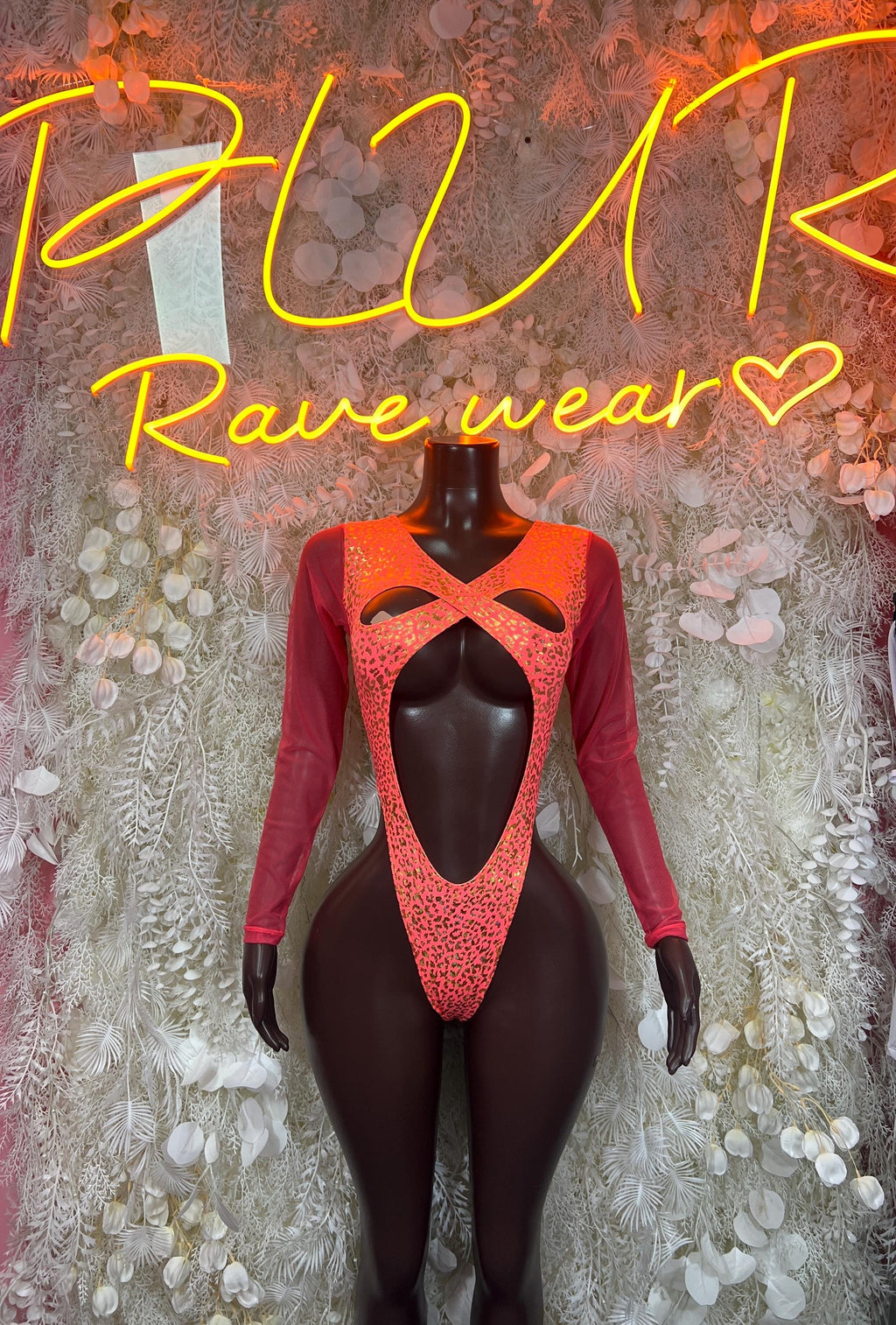 Coral cheetah-print hologram bodysuit with long sleeves and chest cutout