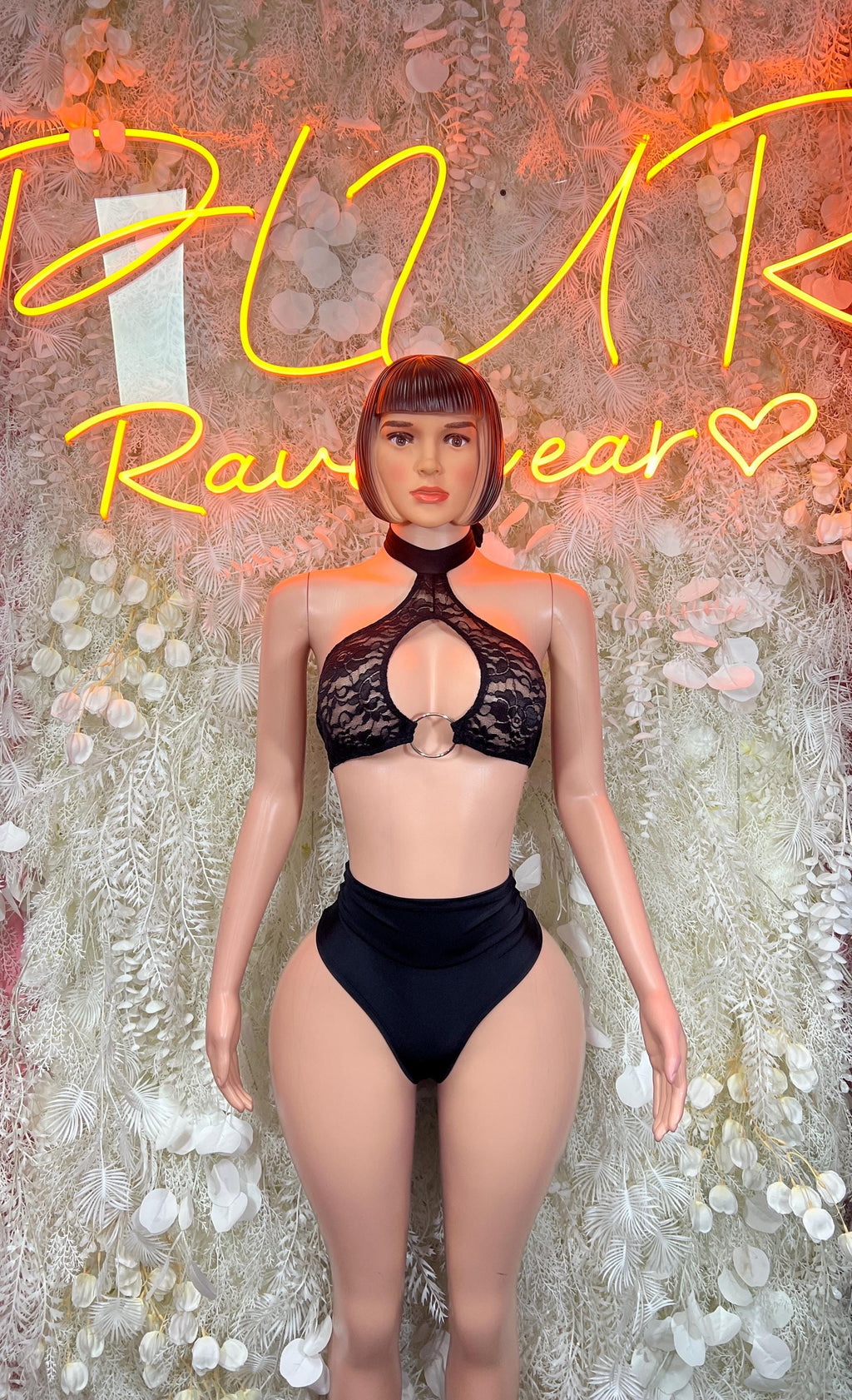 Black lace halter crop top and high-cut thong bodysuit, front view.
