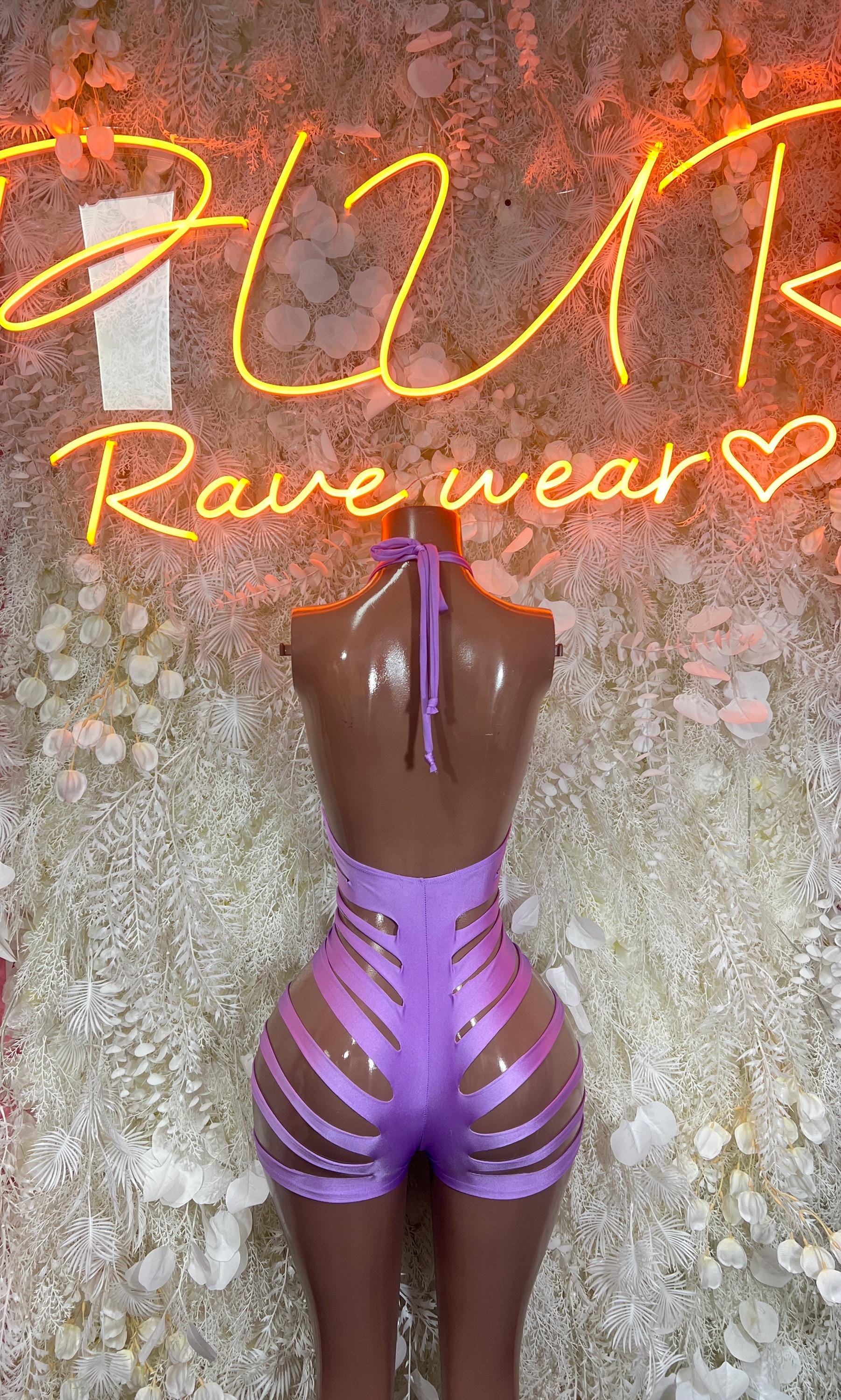 Purple halter one-piece bodysuit with lace-up back cutouts and crisscross straps