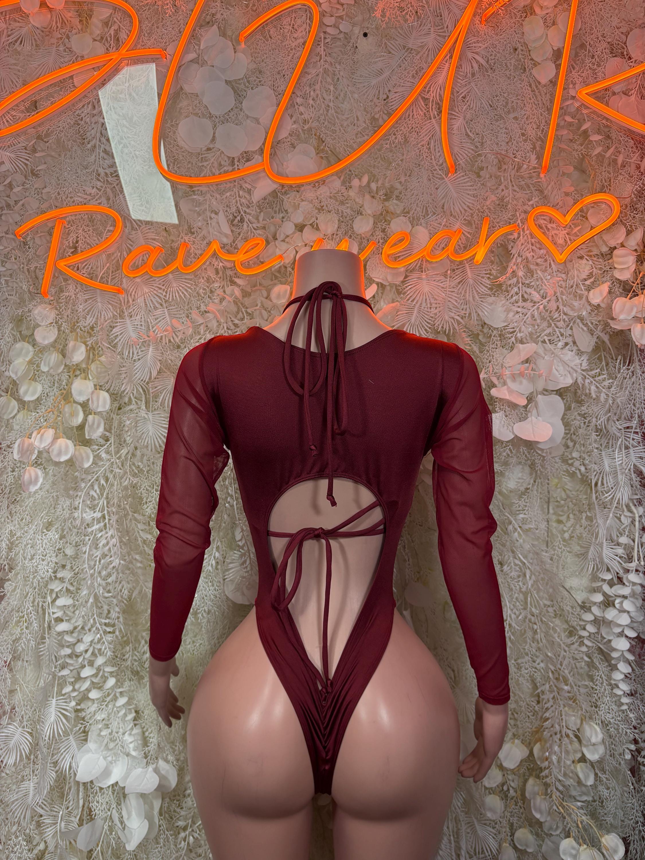 Red velvet backless halter bodysuit with long sleeves and crisscross ties