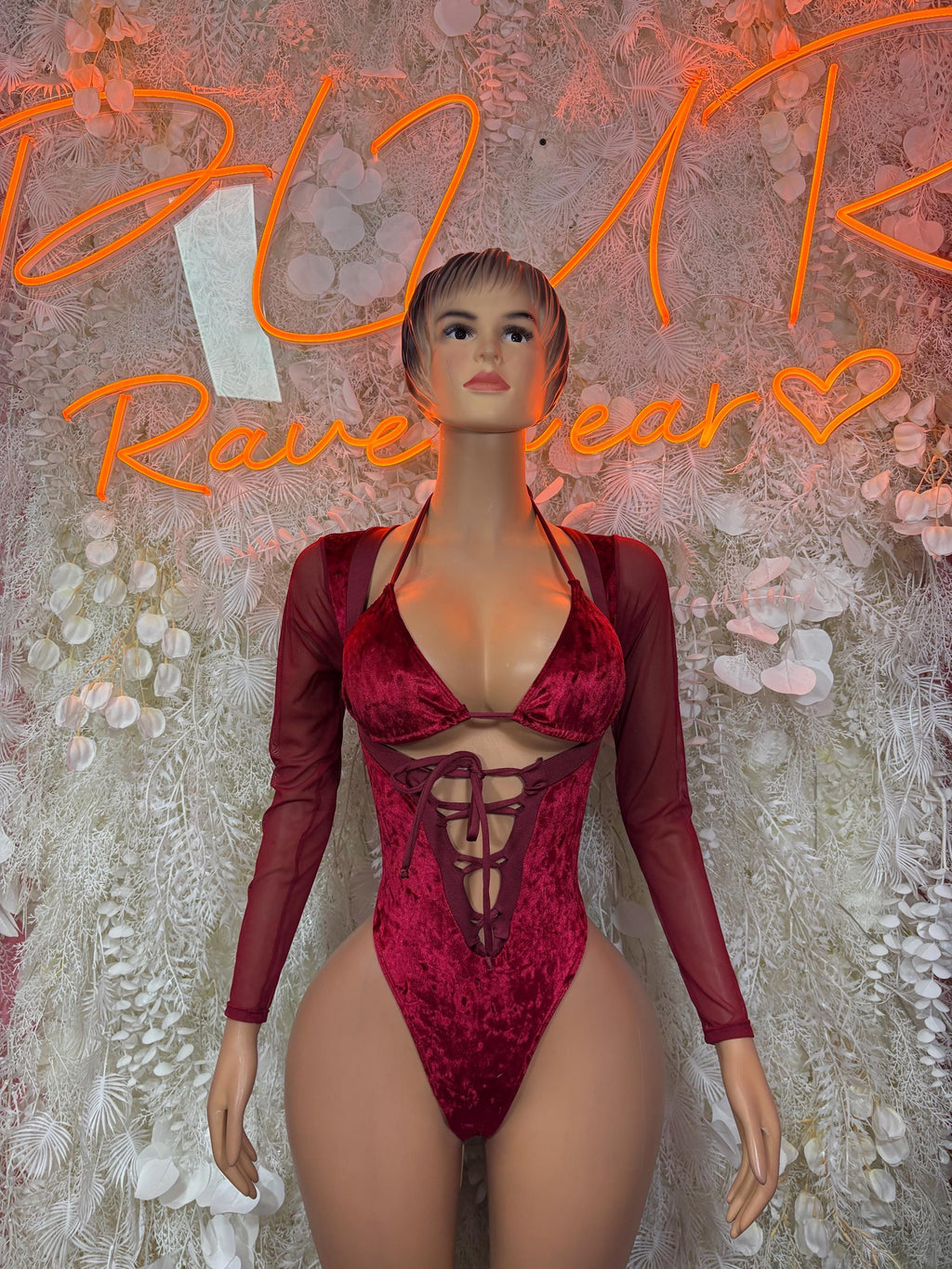 Burgundy velvet bodysuit with long sleeves and lace-up cutout front