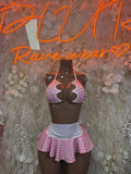Pink plaid rave skirt set with black halter top and ruffled mini skirt