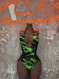 Neon green and black one-piece lace-up bodysuit with strappy details
