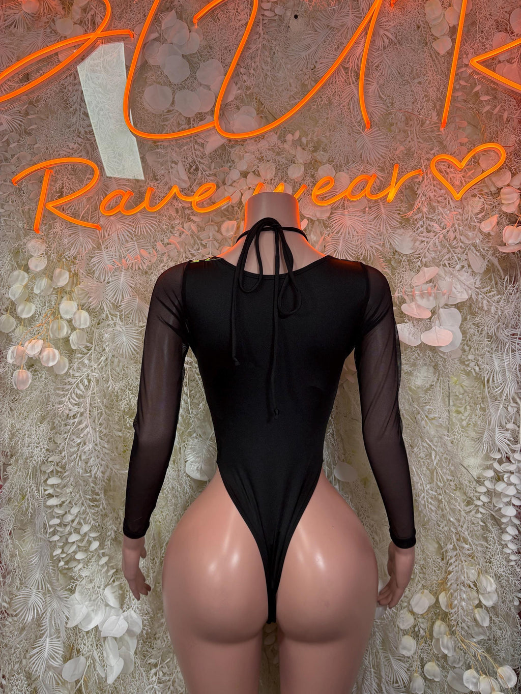 Black one-piece bodysuit with sheer back tie and long mesh sleeves