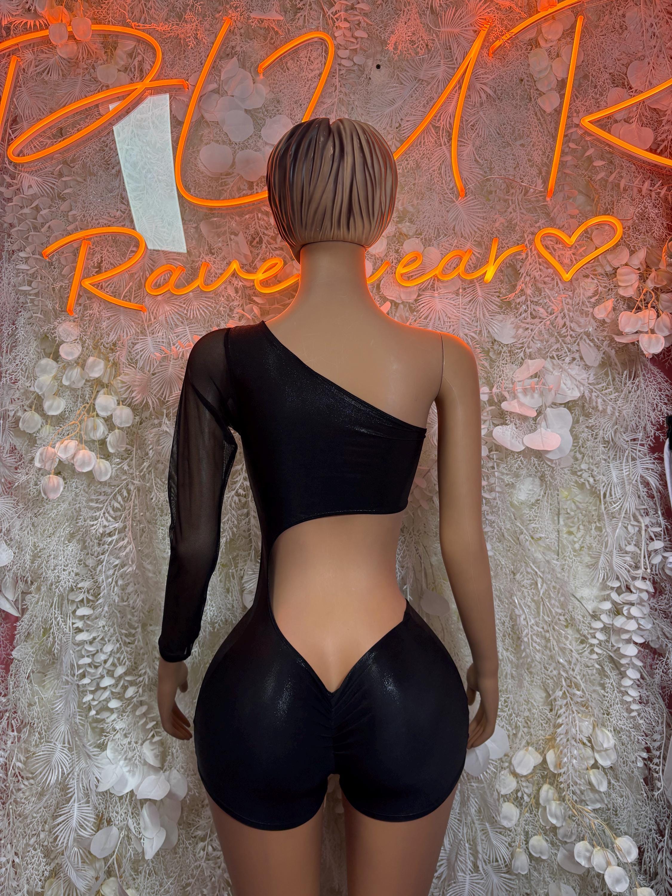 Black two-piece dance set with backless long-sleeve crop top and tie-front shorts