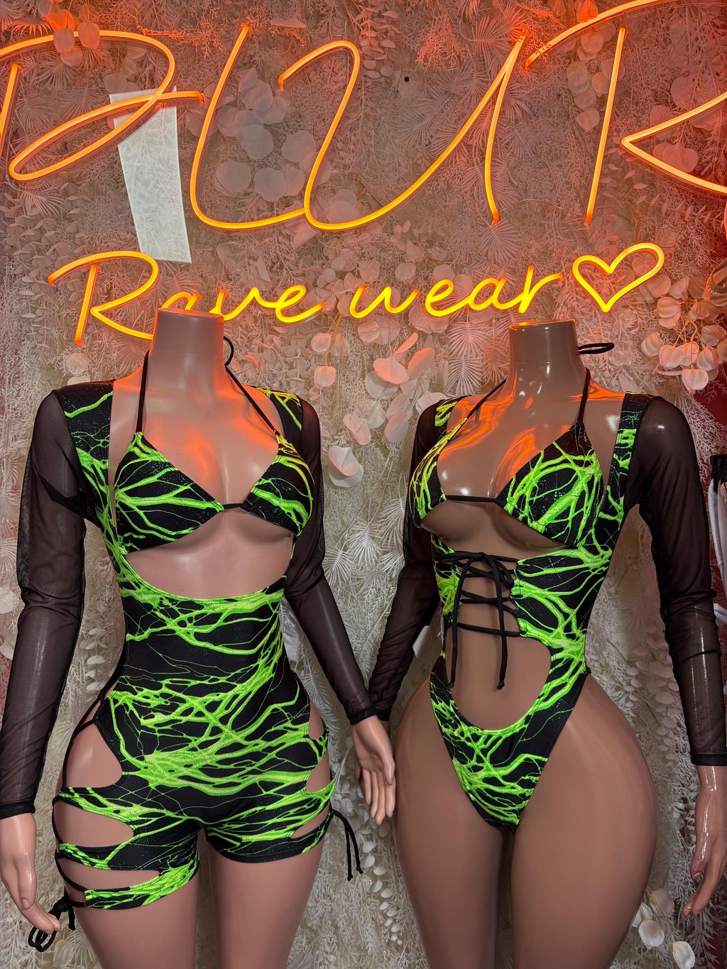 Neon green lightning one-piece bodysuit with long sheer sleeves and cutout sides
