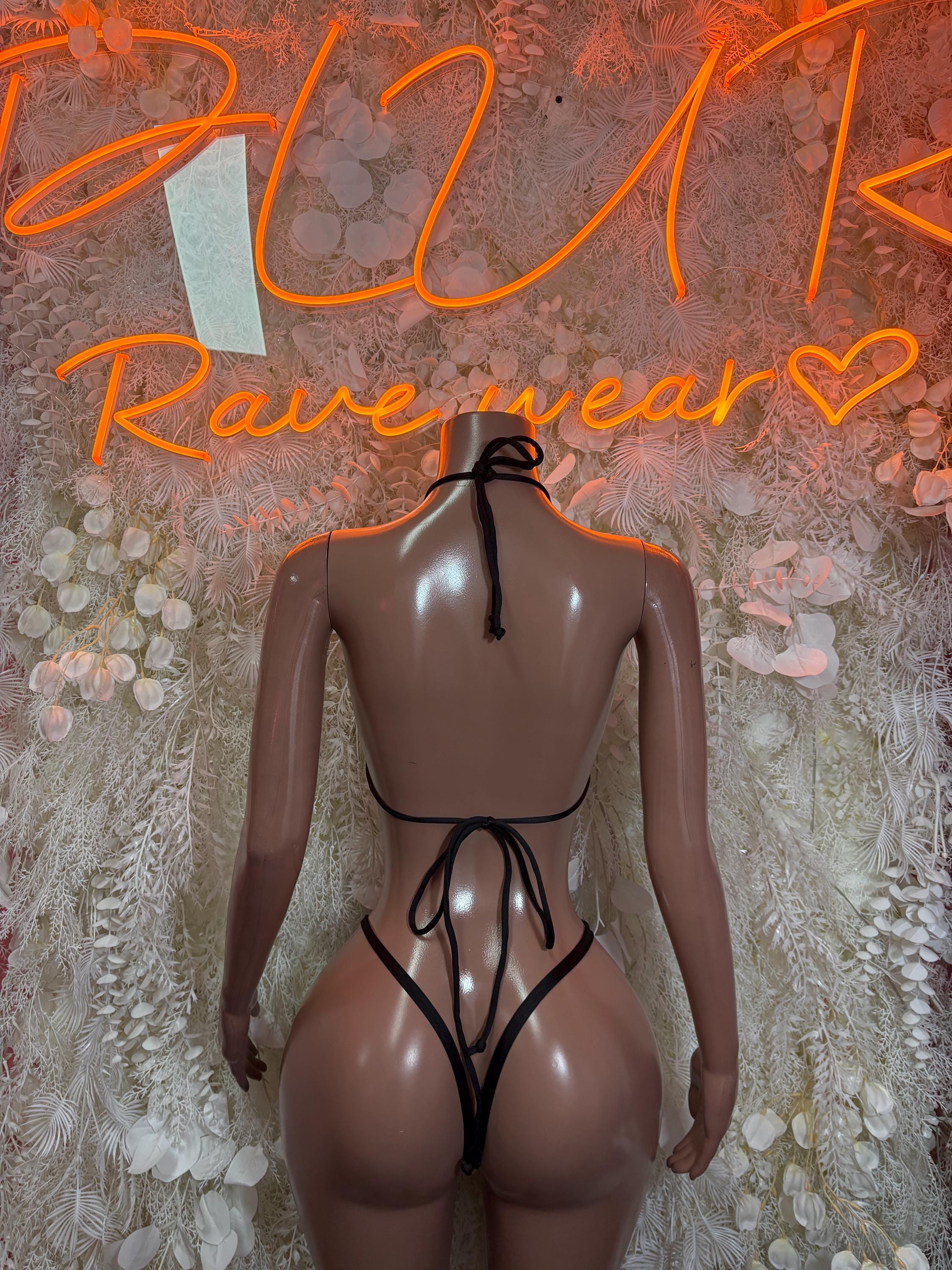 Back view of striped referee-style bikini lingerie set with tie-back thong
