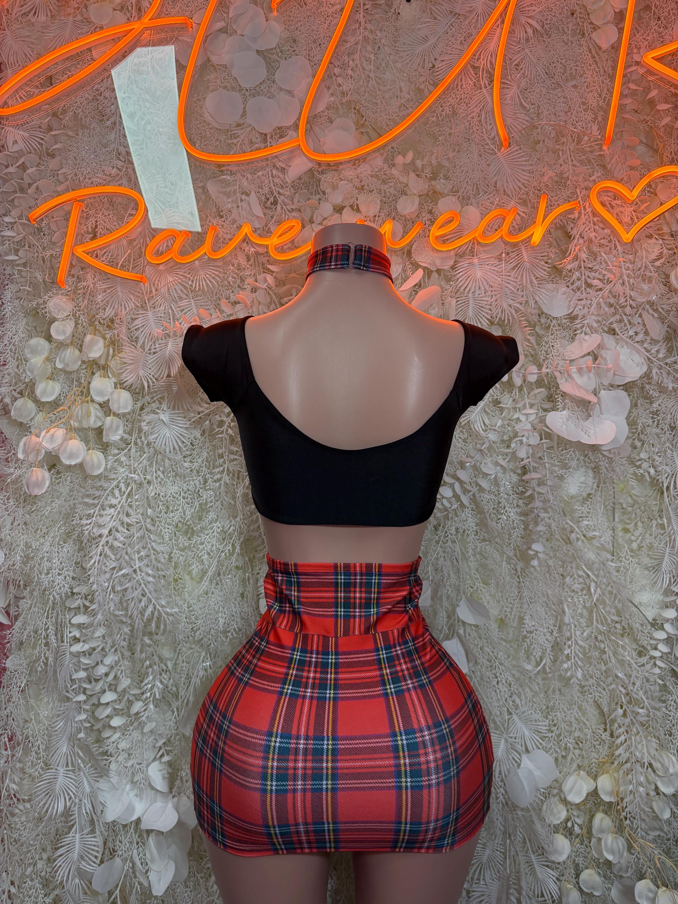 Two-piece skirt set: black backless crop top and red plaid mini skirt