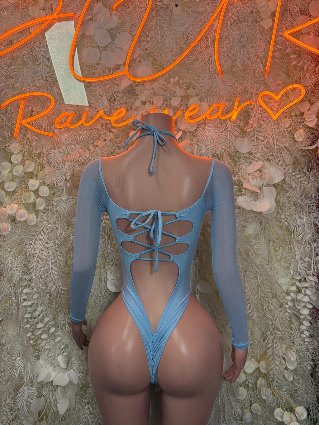 Light blue long-sleeve bodysuit with crisscross lace-up tie at center back
